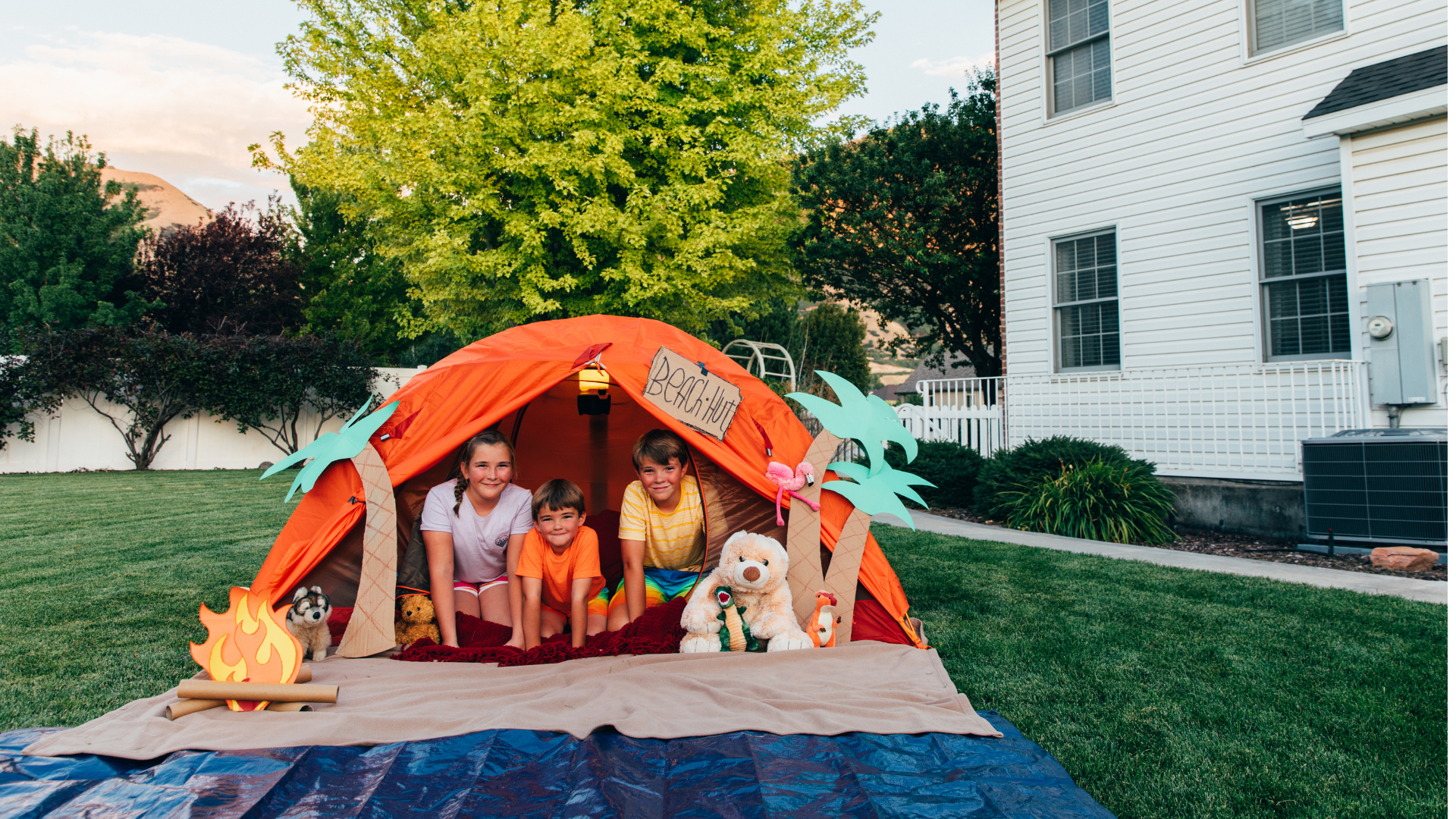 Kids enjoying a backyard staycation at Brunswick Crossing, showcasing the community’s family-friendly vacation-style amenities.