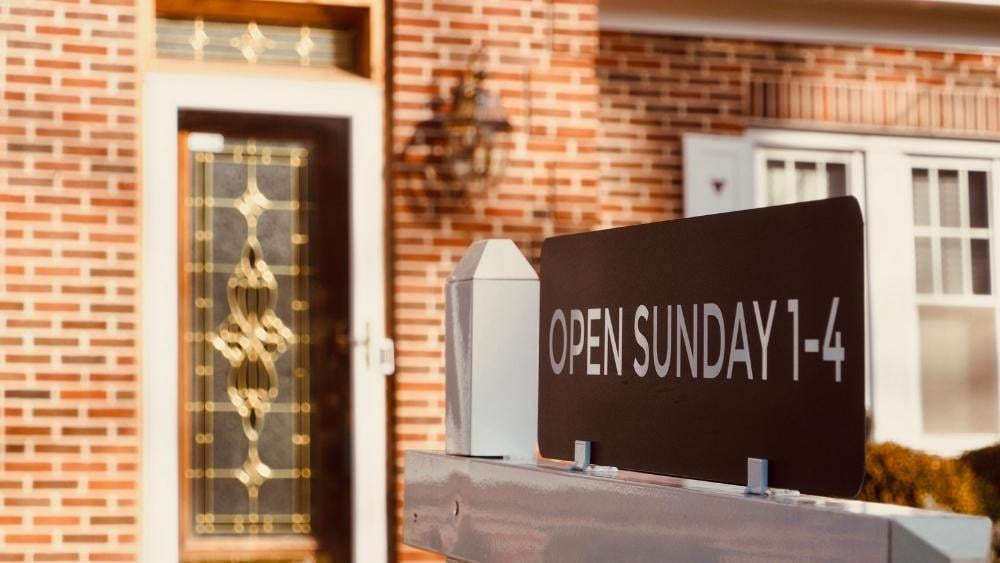 Open house sign in front of a home